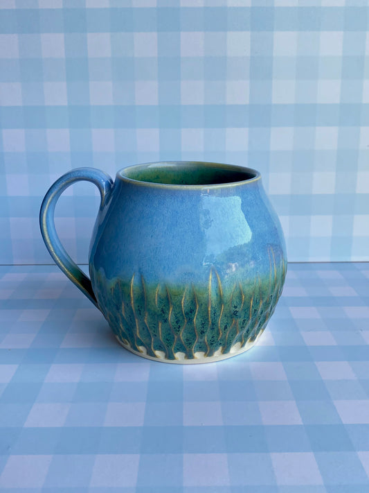 Large Carved Mug in Forest Sky